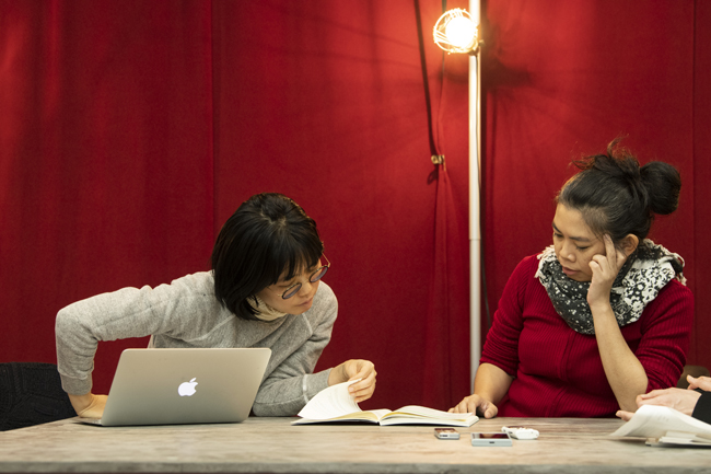 A photo of jaa and Ms. Nakamura looking the book