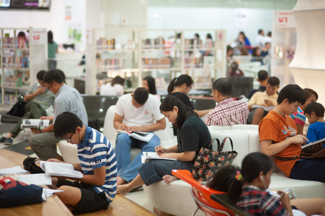 A photo of people reading books