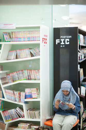 A photo of a girl reading a book